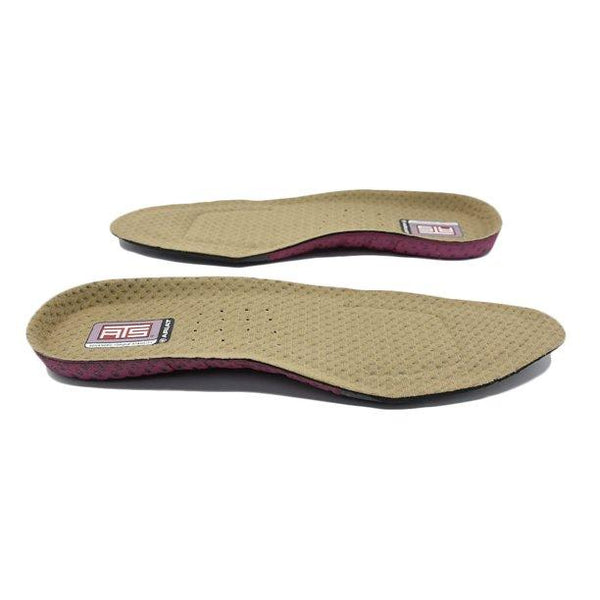 two brown shoe inserts