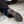 Load image into Gallery viewer, man wearing black pull on boot while kneeling