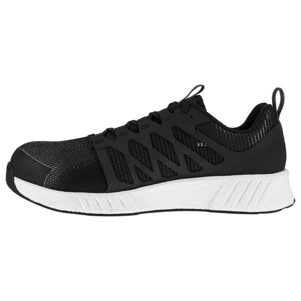 alternate side of black tennis shoe style work shoe with white sole