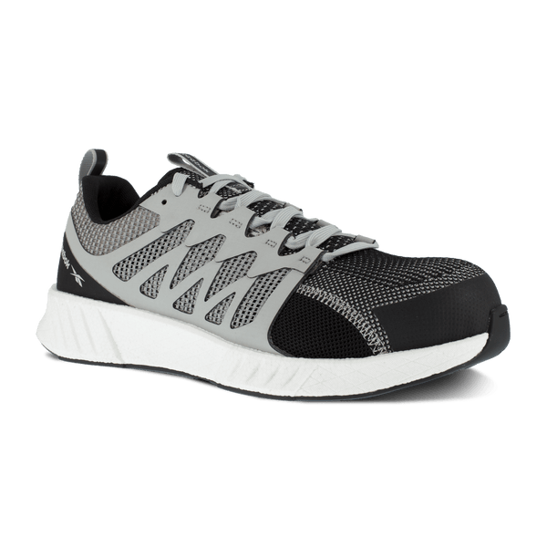 shoe with black toe and grey foot with vent holes and white sole