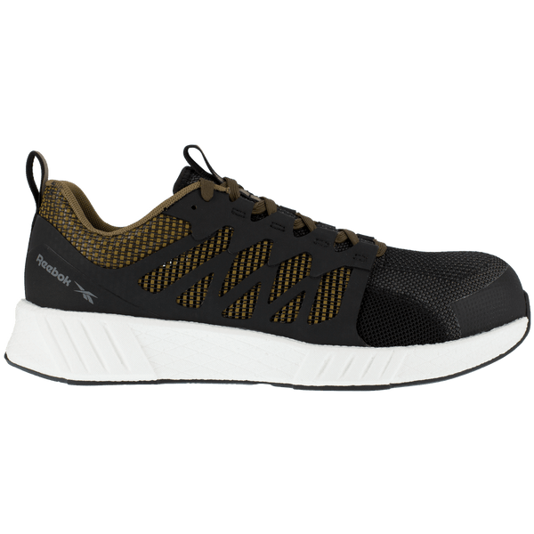 side of black shoe with green underneath black pattern on foot and green laces