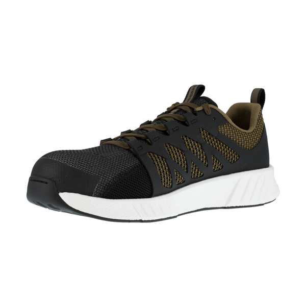 angled view of black shoe with green underneath black pattern on foot and green laces