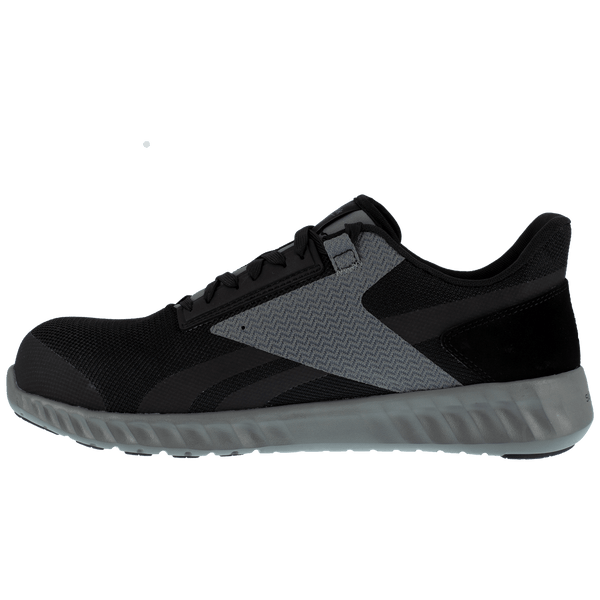 side view of black shoe with grey accent, black laces, grey sole