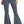 Load image into Gallery viewer, woman wearing medium blue bell bottom jeans, with button details on waistband and tan point toe boots