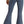 Load image into Gallery viewer, back view of woman wearing medium blue bell bottom jeans, with button details on waistband