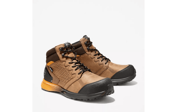 mens light brown logger boot with yellow and black soles. Black toe, heel, and laces.