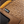 Load image into Gallery viewer, detailed close up of mens light brown logger boot with yellow and black accents. Tag reads "waterproof membrane".