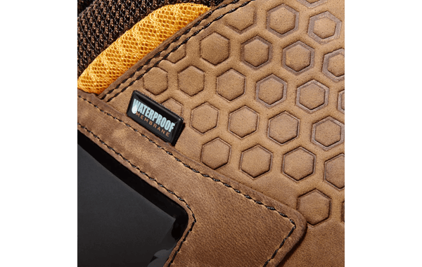 detailed close up of mens light brown logger boot with yellow and black accents. Tag reads "waterproof membrane".