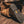 Load image into Gallery viewer, man wearing high top pull on brown boot with black sole while kneeling