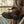 Load image into Gallery viewer, man wearing high top pull on brown boot with black sole while crossing legs