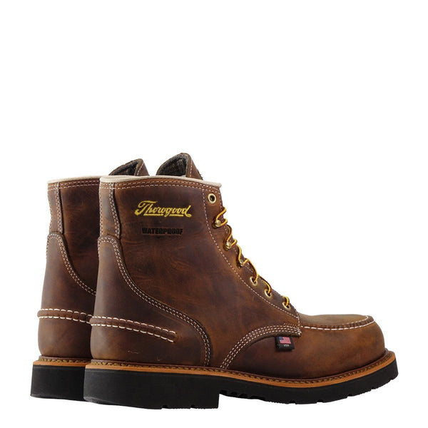 rear side angle of high top brown boot with yellow laces, black sole, and yellow logo on upper shaft