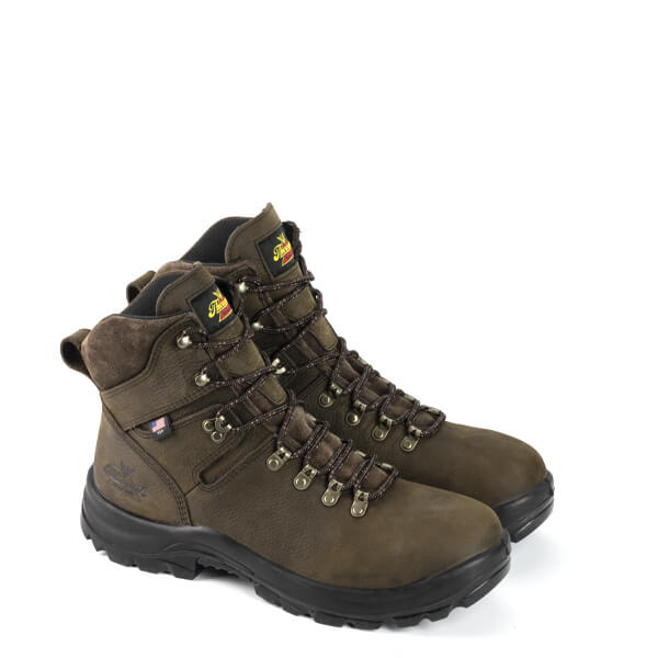 side view of two dark brown boots with black sole and gold eyelets