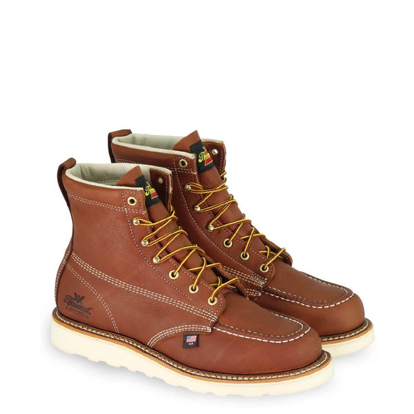 tan moccasin style boot with yellow and brown laces and white sole
