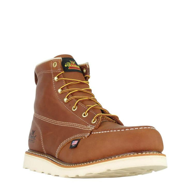 front angle of tan moccasin style boot with yellow and brown laces and white sole