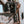 Load image into Gallery viewer, worker standing on edge of metal beam while wearing brown high top moccasin style boots with worn white soles