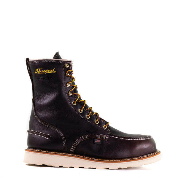 right side view of dark brown high top moccasin style boot with yellow thorogood logo embroidered on shaft and white wedge sole