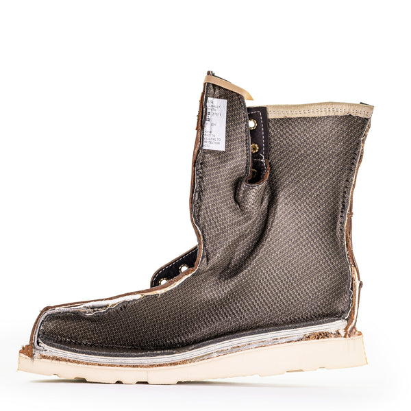 side cut-out interior view of dark brown high top lace up boot with white wedge sole