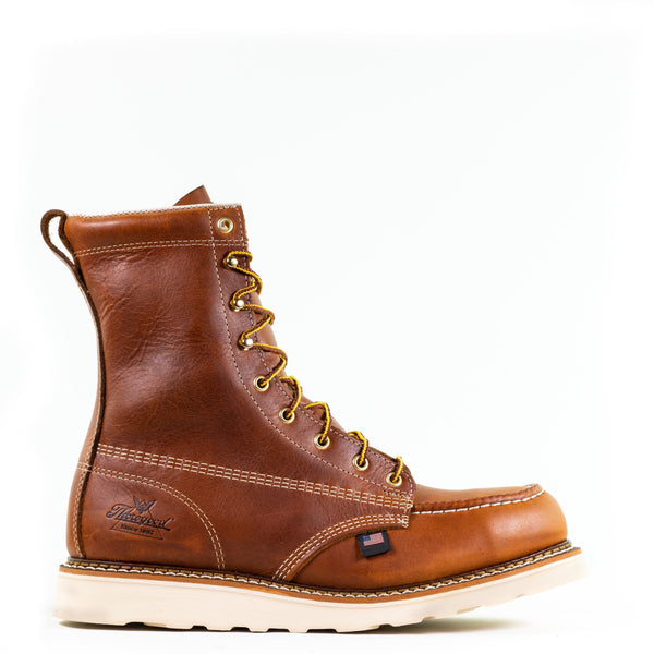 right side view of mens brown logger boot with white interior, stitching, and sole, and brown/gold laces. Black thorogood logo stamped on heel.