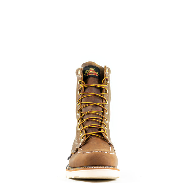 front view of mens brown logger boot with white sole and stitching and thorogood logo on tongue. yellow/brown laces.