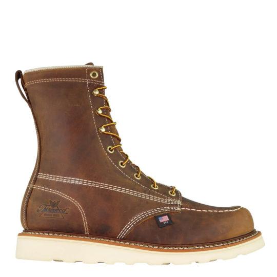 side of dark brown moccasin style boot with yellow and brown laces and white sole