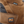 Load image into Gallery viewer, mens brown logger boot with orange line along tan soles. Black toe and tongue zoomed in of patch