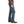 Load image into Gallery viewer, Man in Dark Brown Solid button up and brown belt in rough blue jeans side view