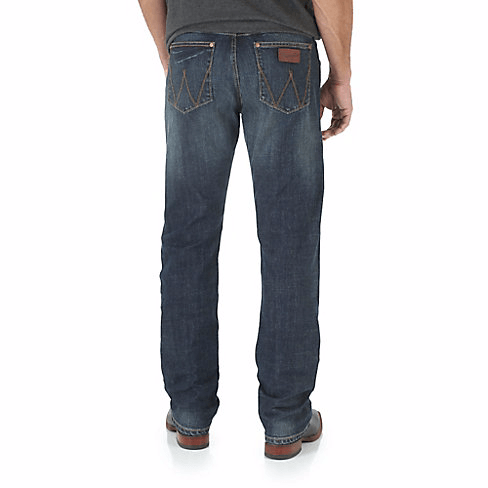 Man in Dark grey shirt & belt with blue jeans back angle