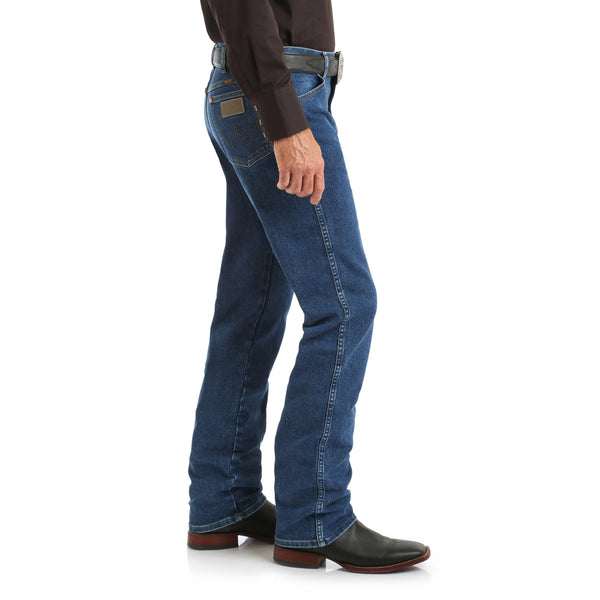 man in brown solid button up and brown belt wearing blue jeans side view