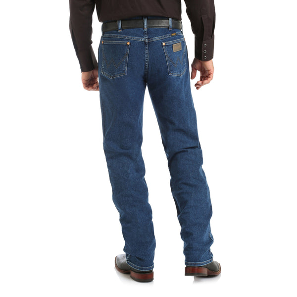 man in brown solid button up and brown belt wearing blue jeans