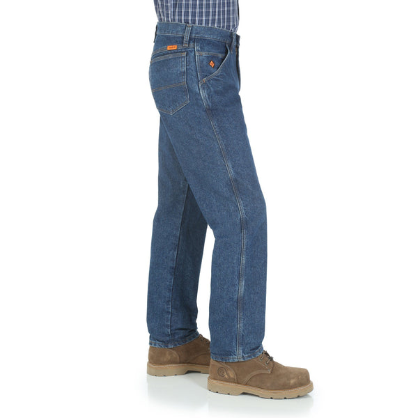 man in blue patterned button up with no belt in blue jeans