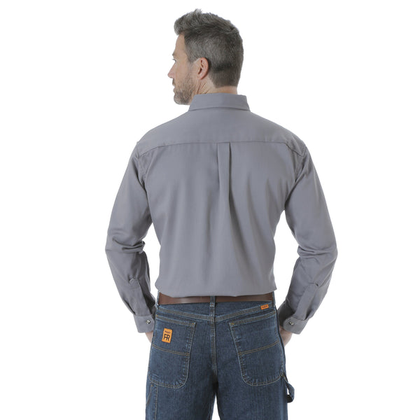Man with hands in pocket wearing solid grey button up back view