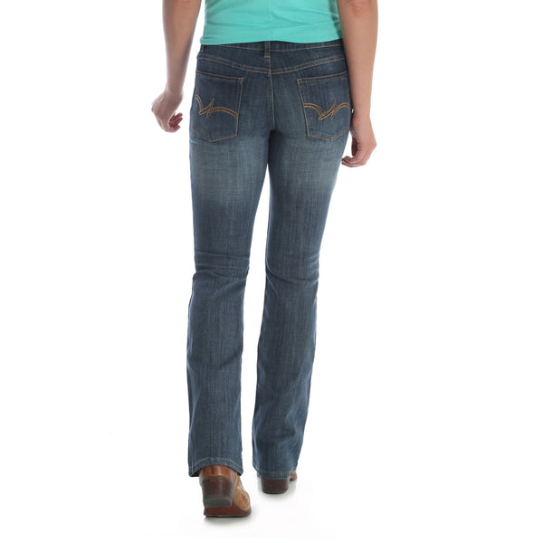 woman in teal wearing faded blue jeans back view