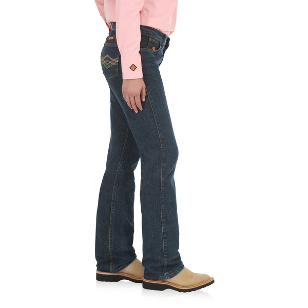 woman in pink button up wearing dark blue jeans side angle