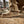 Load image into Gallery viewer, Close-up of a tan work boot with Ariat logo on a construction site background
