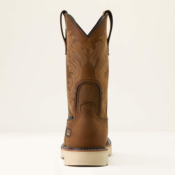 Rear view of a brown cowboy boot with intricate design on a beige background