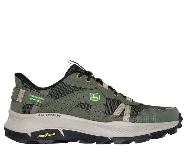 Right side view of olive green Skechers slip-in trail shoe with John Deere logo, featuring a lace-up closure, mesh fabric, and a rubber all-terrain outsole.