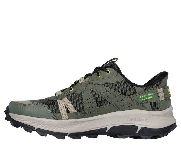 Left side view of olive green Skechers slip-in trail shoe with John Deere logo, featuring a lace-up closure, mesh fabric, and a rubber outsole.