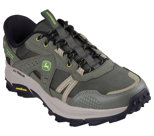 Olive green Skechers slip-in trail shoe with John Deere logo, featuring a lace-up closure, mesh fabric, and a rubber outsole.