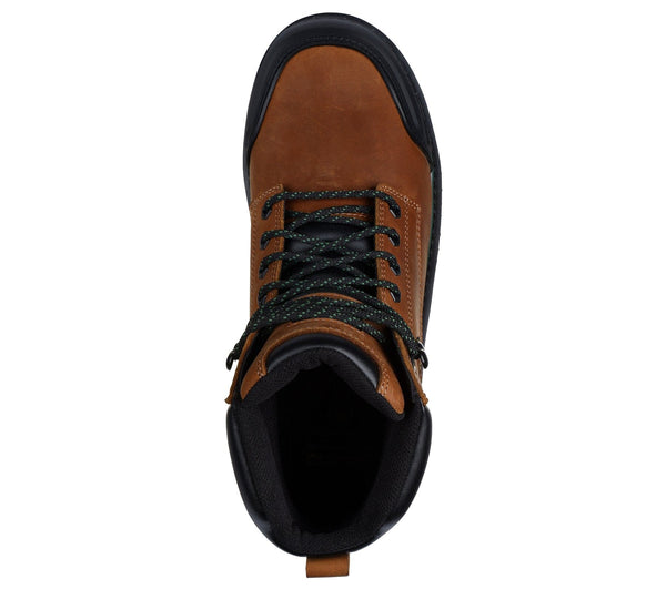 Top view of a lace-up work boot with a leather upper featuring a padded collar, brown in color, with green and black detailing on a white background.