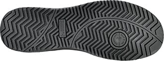 Black sole of a women's work shoe with tread pattern and Puma logo in center.