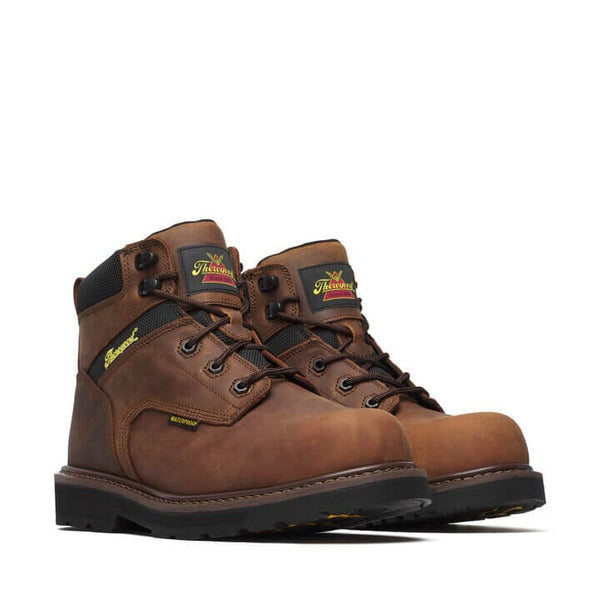 A pair of brown Thorogood Crazy Horse waterproof safety toe work boots with a lace-up closure.