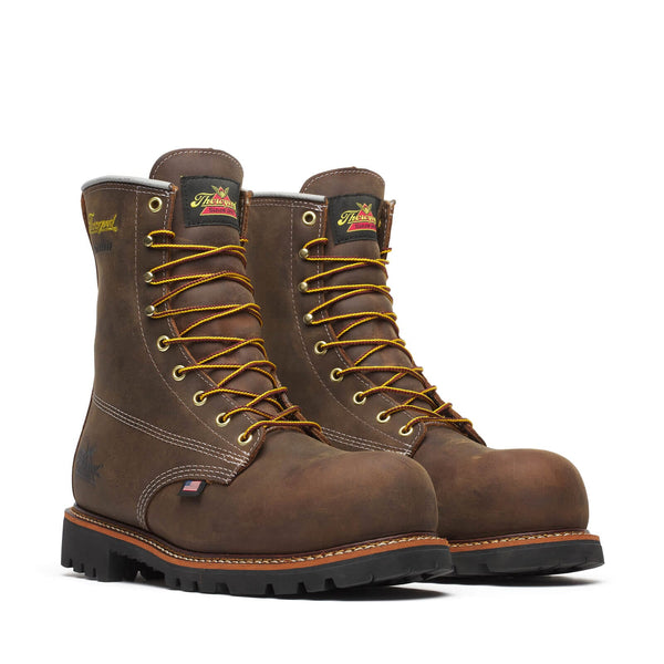 A pair of brown Thorogood Crazyhorse full-grain leather work boots with a lace-up closure, featuring a round toe and a Vibram Olympia rubber outsole.
