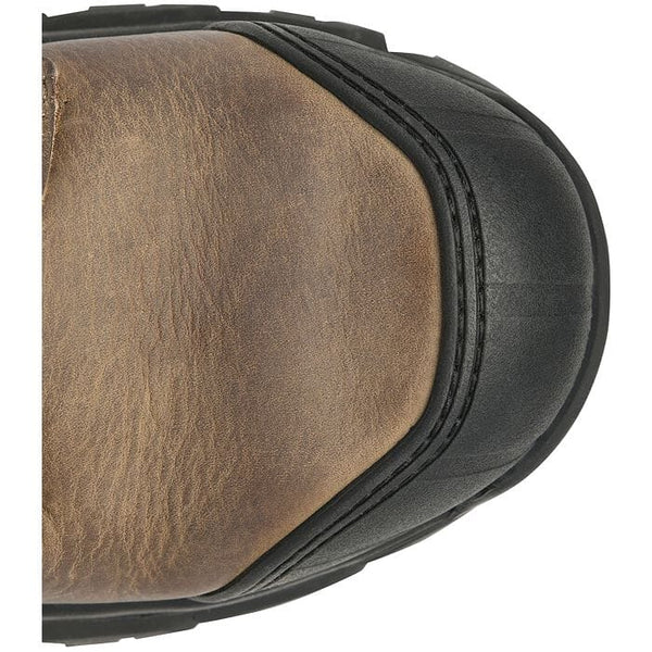 Close-up of a round toe of a brown leather boot with a black sole on a white background