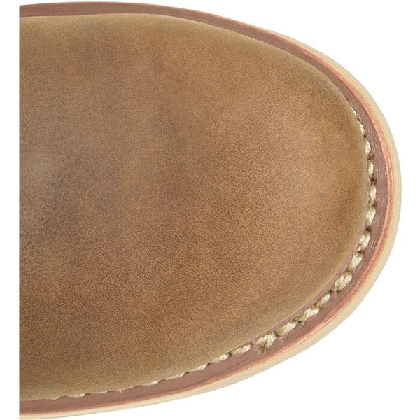 Close-up of a brown leather boot toe with visible stitching on a white background