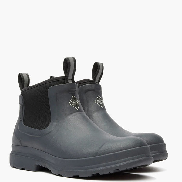 Pair of Black rubber boots with black elastic sides on a white background