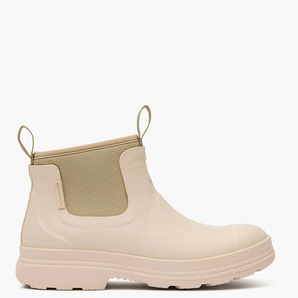 Right side view of beige rubber boot with a white background