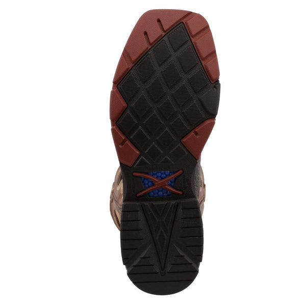 Black and orange sole of square toe work boot with criss-cross tread pattern.