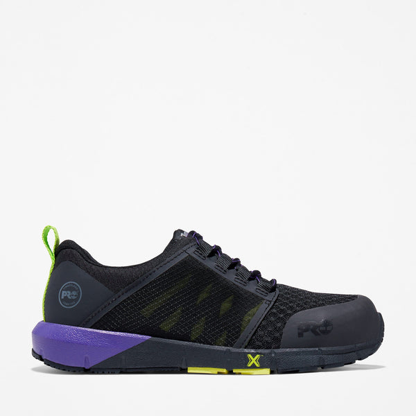 Black athletic lace-up shoe with purple sole and green accents on a white background