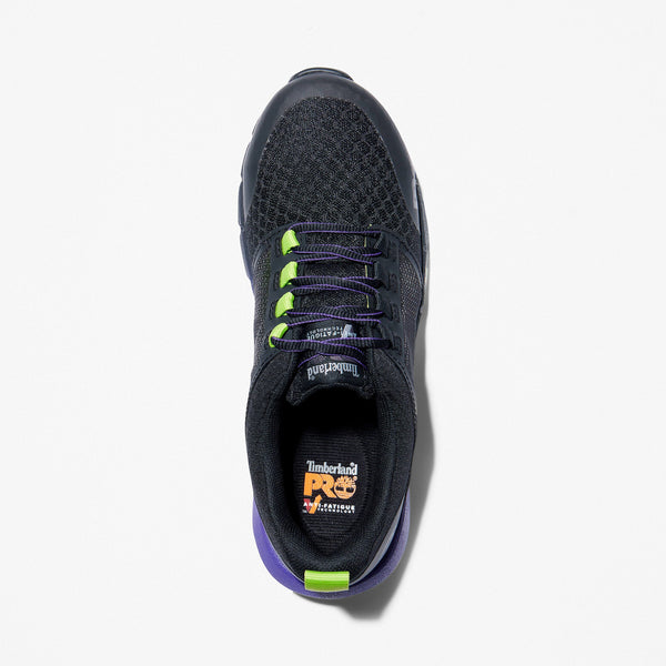 Top view of a black athletic lace-up shoe with green and purple accents on a white background