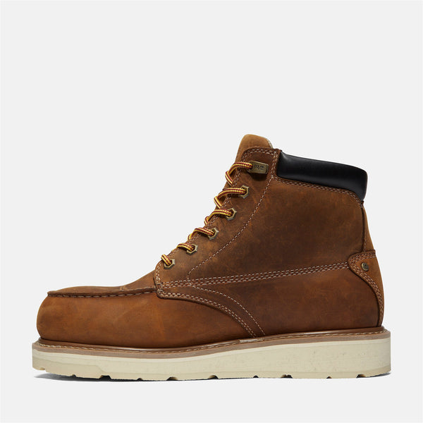 Left side of brown leather boot with white sole on a white background